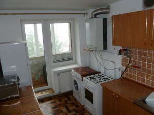 The kitchen with small balcony/pantry